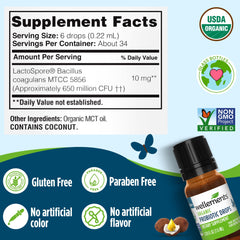 Wellements Organic Baby Probiotic Drops bottle near nipple for easy administration