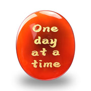 WHAL&YUNE red agate worry stone front view with engraved side for tactile use