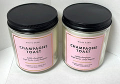 White Barn Champagne Toast candle packaging display shows the 2-pack for cozy gatherings.