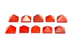 Wholesale Gem Shop red jasper pyramid resting on velvet pouch.