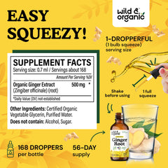 Dropper dispensing ginger liquid from the bottle for precise servings.