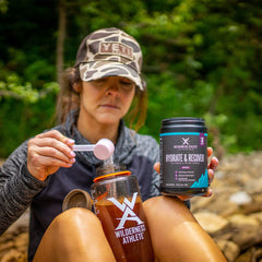 Wilderness Athlete grape powder scoop shows easy mixing and flavor.