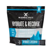 Wilderness Athlete Hydrate and Recover blue raspberry packet ready for on-the-go hydration.