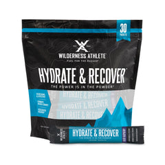 Wilderness Athlete Hydrate and Recover blue raspberry packet ready for on-the-go hydration.