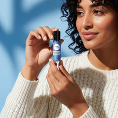 Wink Well magnesium gel roller on neck and arms for nightly calm.
