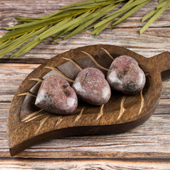 Wish Well Rhodonite heart stone in hand illustrating tactile calm during daily mindfulness