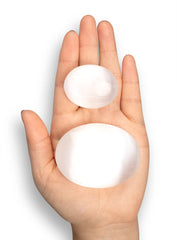 Wish Well selenite palm stone oval closeup for meditation focus.