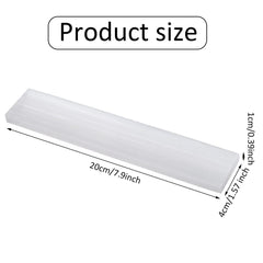 Yalikop selenite plate serving as a crystal charging station for jewelry and stones.