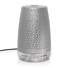 Yankee Candle Sleep Diffuser in-bedroom scene suggests timer-based relaxation.
