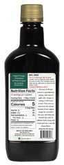Yoder Naturals pouring ACV into a glass for daily energy and focus