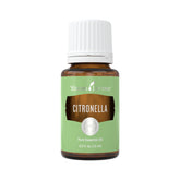 Young Living Citronella essential oil bottle on table for outdoor freshness.