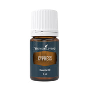 Young Living Cypress essential oil bottle pour for grounding aromatherapy.