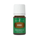 Young Living Hinoki essential oil bottle diffusing for a refreshing ambience.