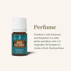 Pouring Young Living Idaho Blue Spruce oil for topical application and massage.