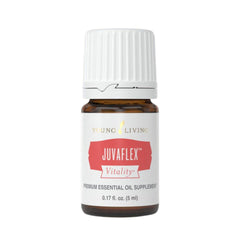 Young Living JuvaFlex Vitality bottle poured for daily wellness routine.