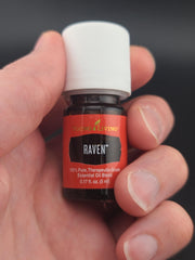 Raven essential oil packaging on display highlighting purity.
