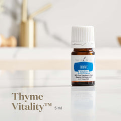 Young Living Thyme Vitality 5ml bottle closeup, pure flavor for savory dishes.
