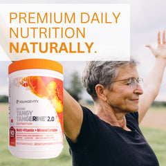 Youngevity Beyond Tangy Tangerine 2.0 pour-spoon demonstrates easy mixing for daily use.