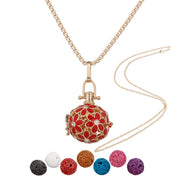 YoungJewl chrysanthemum diffuser pendant, rhinestones, elegant aromatherapy on the go.
