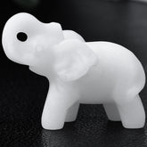 Ytbeoxk white jade elephant figurine close-up showing smooth finish and calming desk presence.