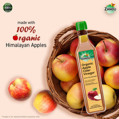 Zandu Organic Apple Cider bottle closeup amber color, natural fermentation notes.