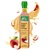 Zandu Organic Apple Cider with Mother in bottle on counter, ideal for dressings.