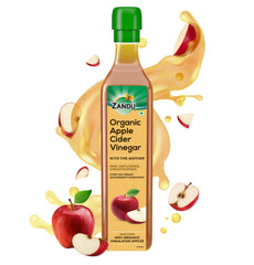 Zandu Organic Apple Cider with Mother in bottle on counter, ideal for dressings.