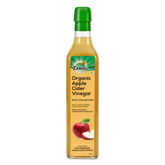 Zandu Organic Apple Cider with Mother in bottle on counter, ideal for dressings.