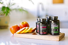 Zeal Naturals capsules with a glass of water for easy daily digestion.