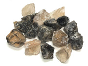 Zentron Crystal Collection smoky quartz rough stones in velvet bag for tumbling projects.