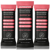Zerospike No Sugar Electrolytes packets with grapefruit in a glass for quick hydration.