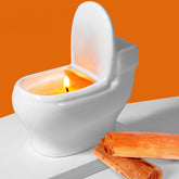 Zhanghe toilet-shaped candle with sandalwood scent enhances humor and ambient fragrance in any room.