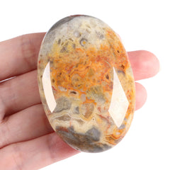 ZHIYUXI Crazy Lace Agate palm stone in oval closeup for calm focus