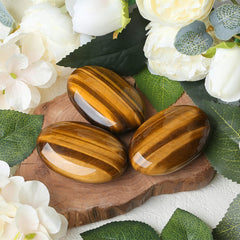 ZHIYUXI tiger's eye palm stone on desk as energy-balancing decor