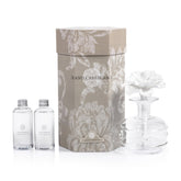 Zodax Grand Casablanca porcelain diffuser with flower design enhances living room ambiance.
