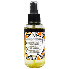 Zum Mist Patchouli-Orange spray in hand ready to freshen spaces.