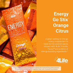 4Life Energy Go Stix open sachet beside glass of orange citrus drink.