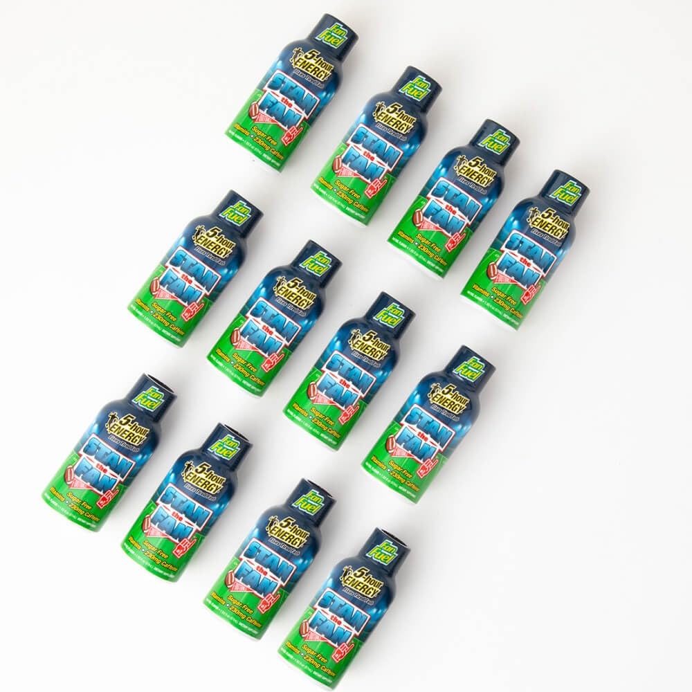 5-hour ENERGY shot next to laptop supports sustained alertness during tasks.