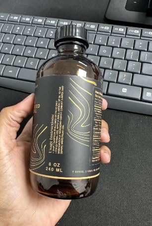 7 Seeds Black Seed Oil bottle highlights cold-pressed origin and natural color.