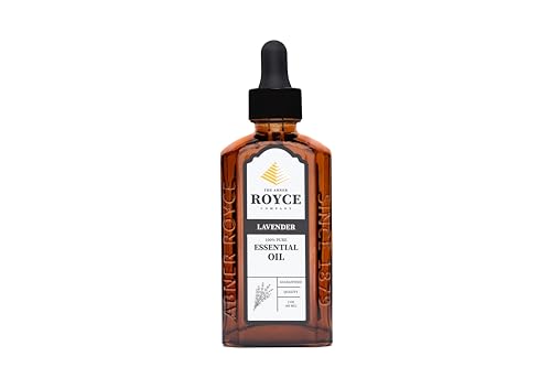 Abner Royce Lavender Oil beside a diffuser for ambient floral fragrance