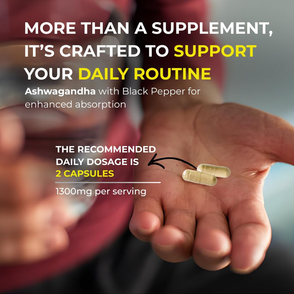 A hand holding Active Bounty Ashwagandha capsules for daily use.