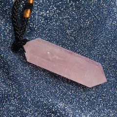 Acxico Rose Quartz Pendulum Necklace in hand for portable calm and focus