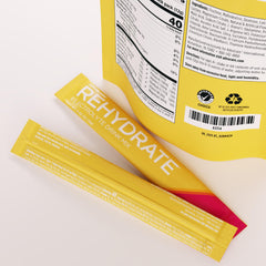 AdvoCare Rehydrate electrolyte powder container highlights mango pineapple flavor.