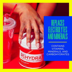 AdvoCare Rehydrate glass with raspberry drink ideal for pre- or post-workout hydration.