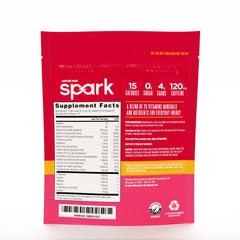 Opened AdvoCare Spark stick pack beside a glass for on-the-go energy.