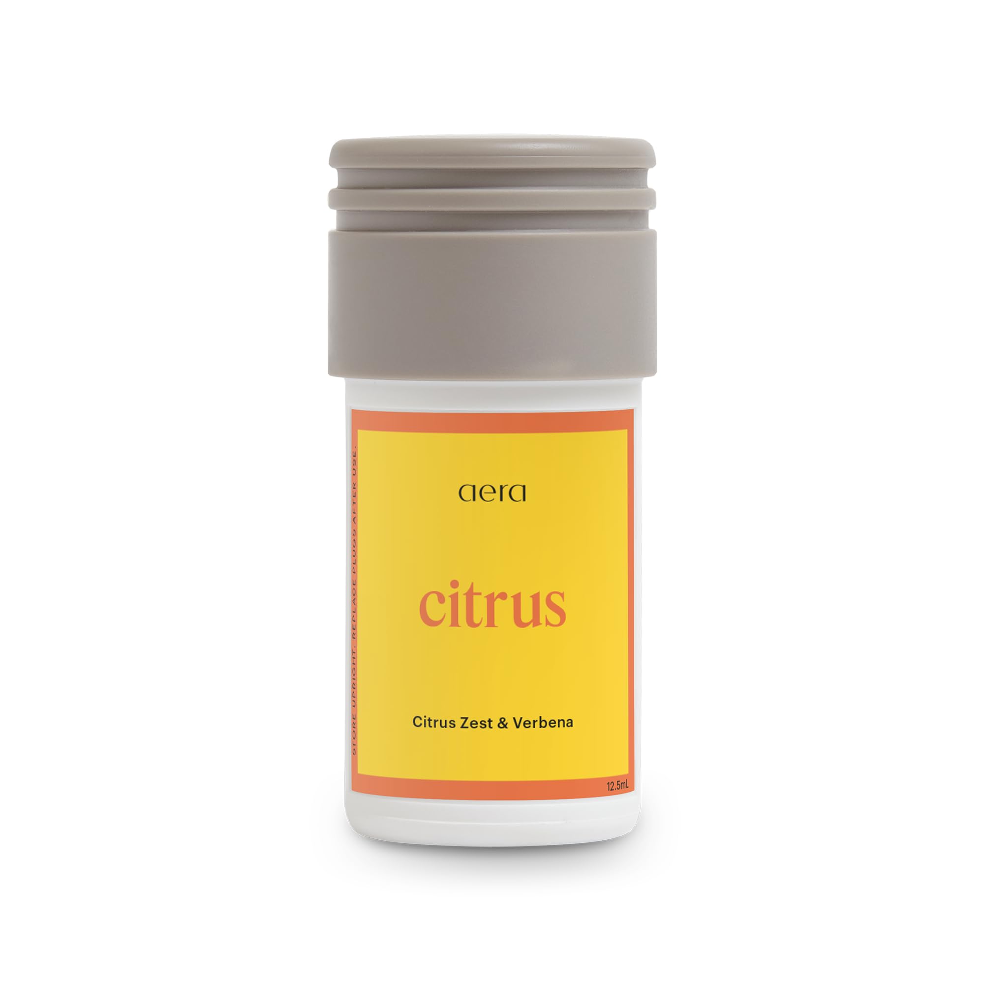 Aera Mini Citrus bottle cap close-up demonstrates premium oils for a clean aroma