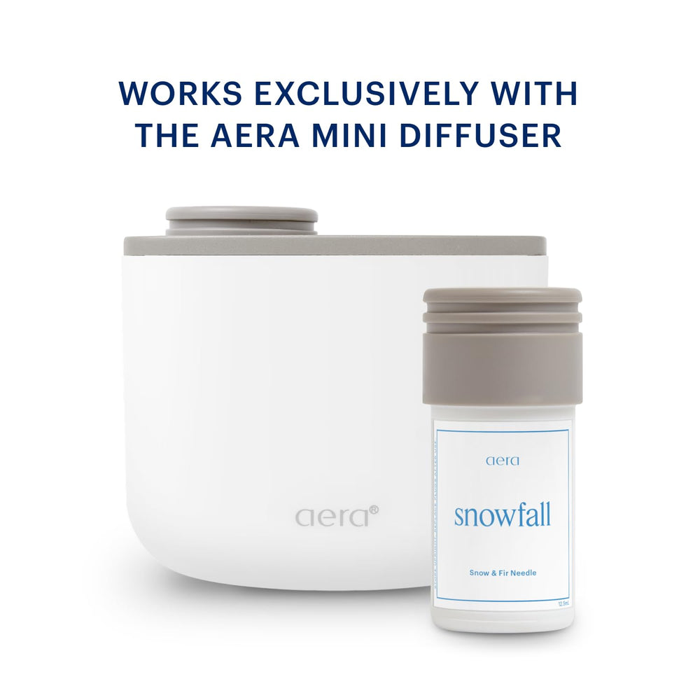 Snowfall refill packaging beside the diffuser for easy home scenting.