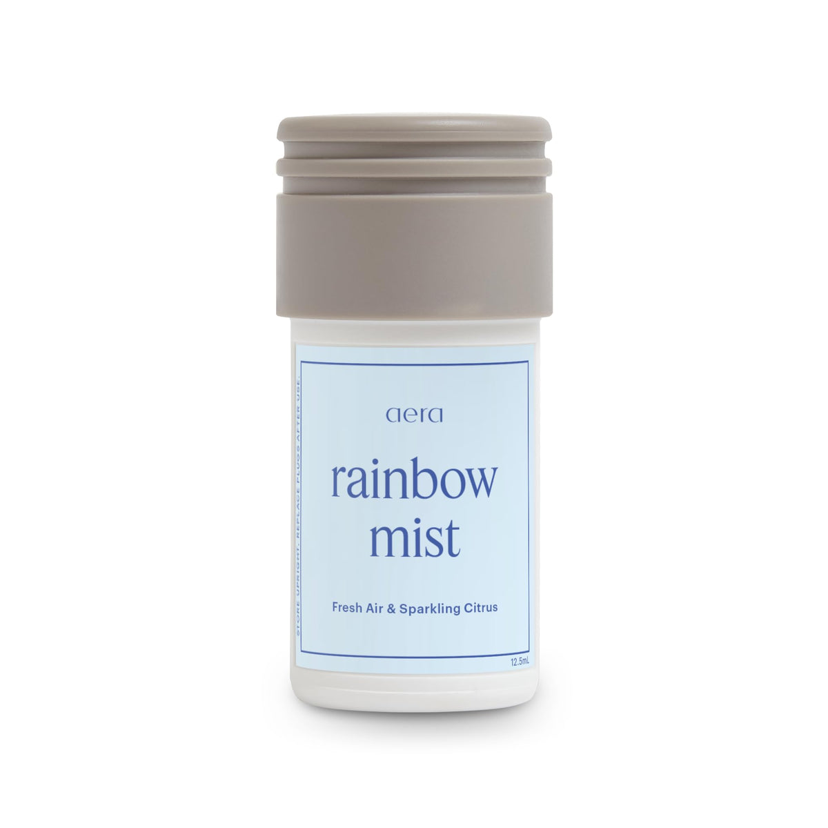 Aera Rainbow Mist bottle with cap releasing fresh citrus notes for a calming room scent.