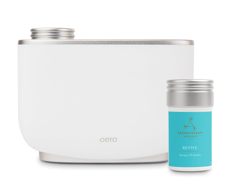 Aera Revive capsule perched on shelf signaling ambient mood lift.