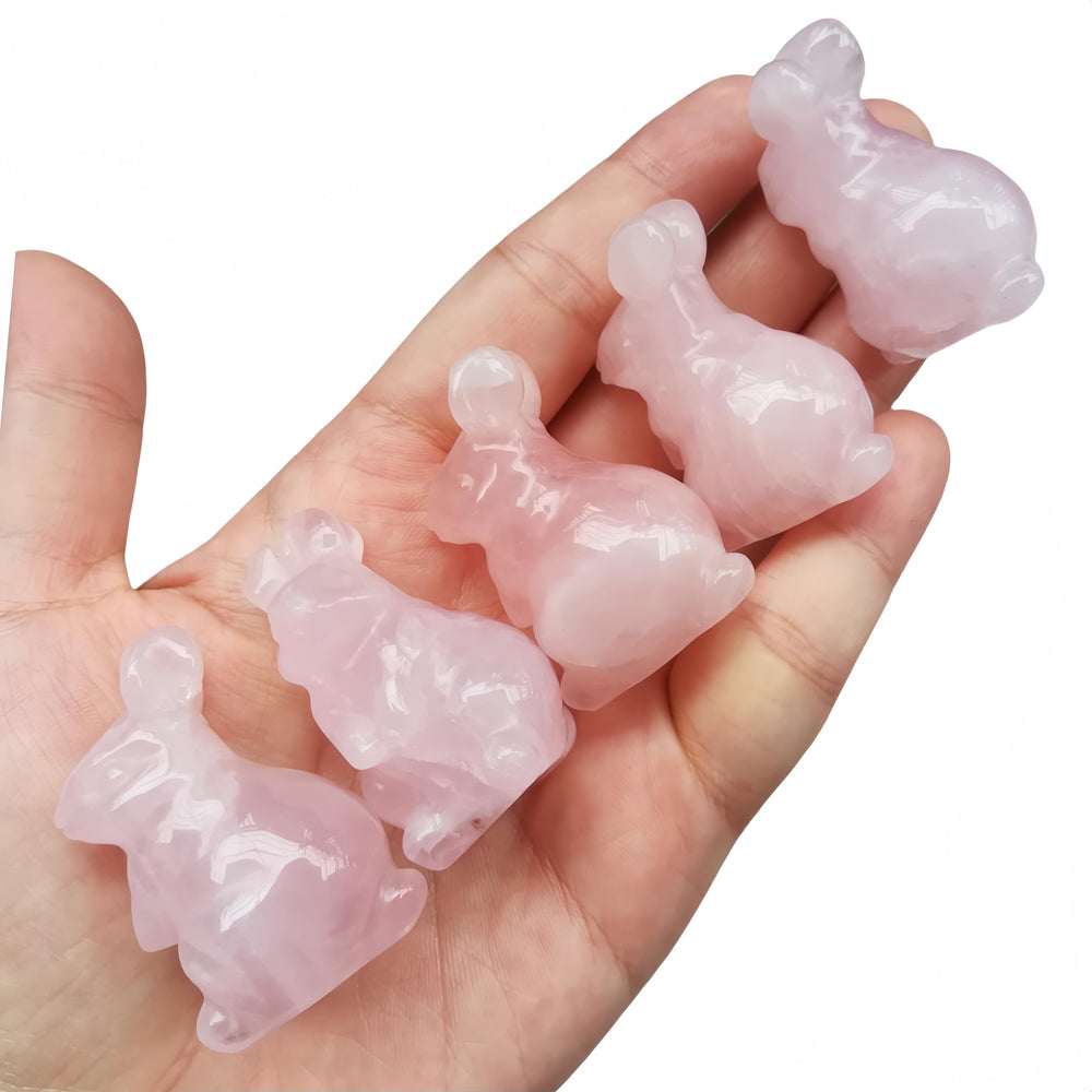 Afucats rose quartz rabbit side view showing stone grain on shelf